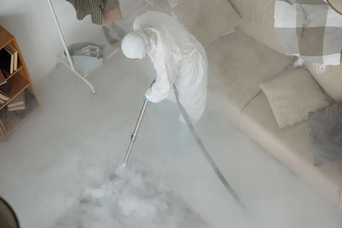 Biohazard cleanup technician in protective equipment, Hermosa Beach, CA